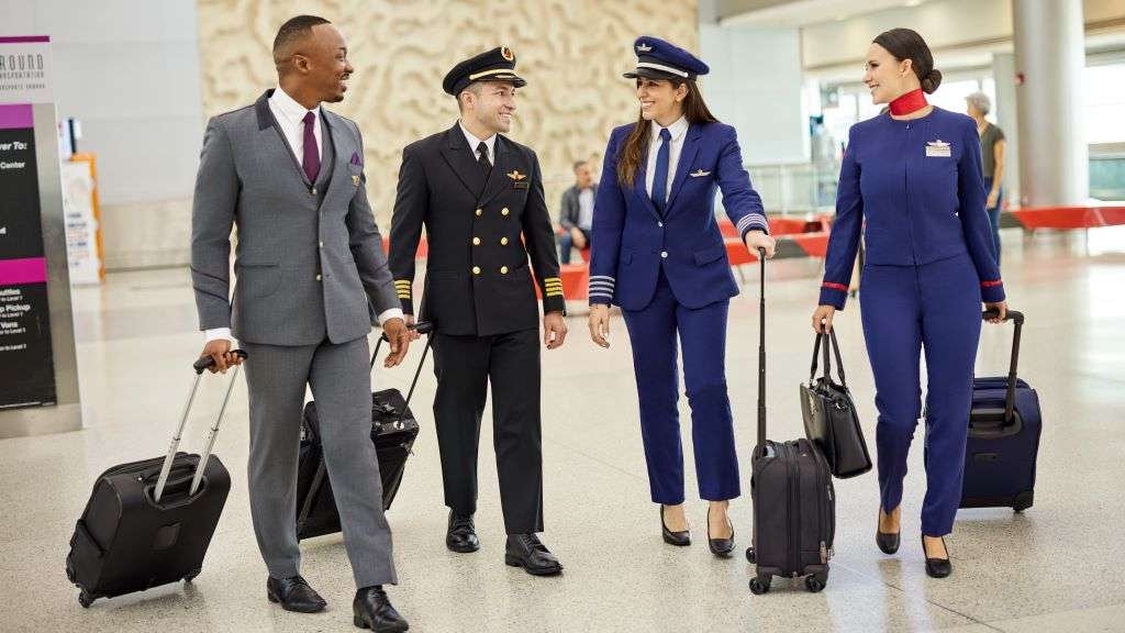 Delta and LATAM flight attendants in the terminal.