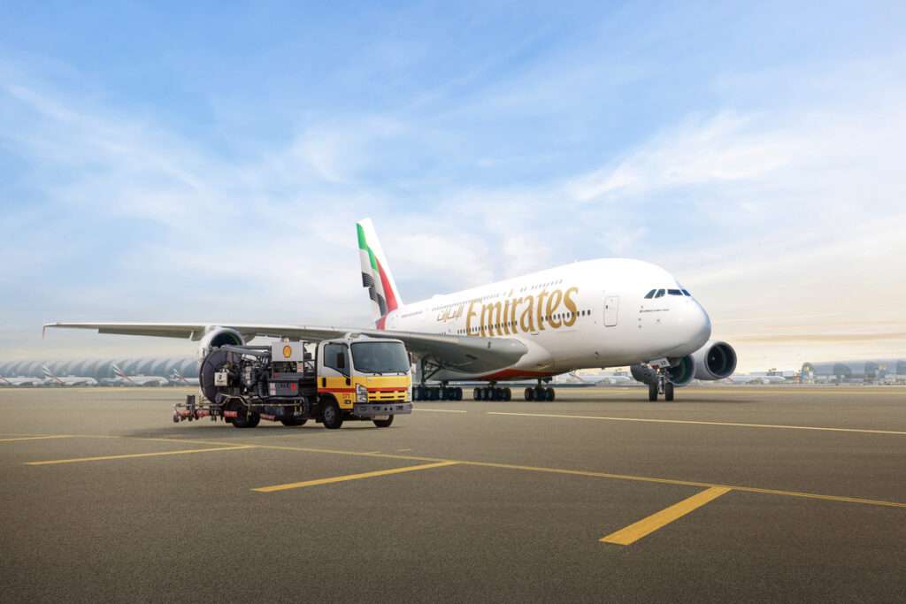 An Emirates aircraft is fuelled by a Shell Aviation tanker.