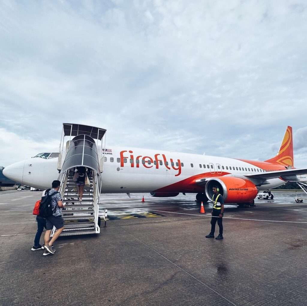 A Firefly Boeing 737 with boarding stairs deployed on the tarmac.