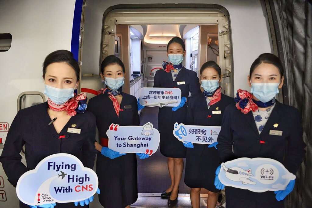 China Eastern Airlines cabin crew on themed flight from London to Shanghai
