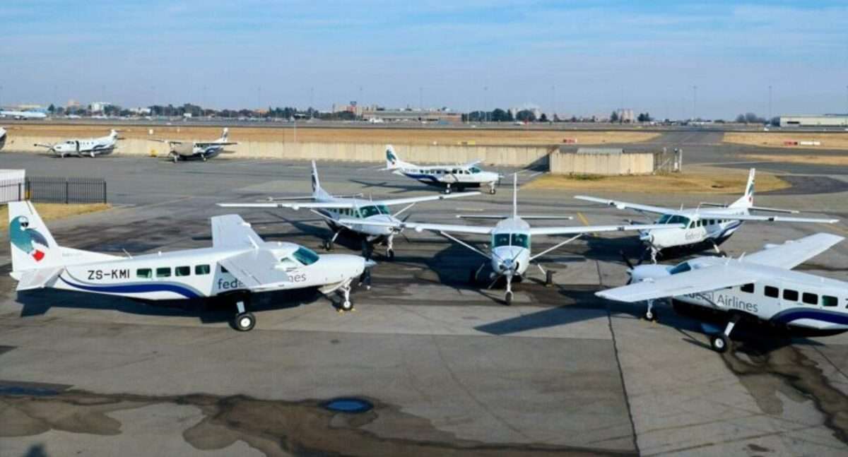 Six FedAir Cessna Caravan C206B EX aircraft parked on the tarmac.