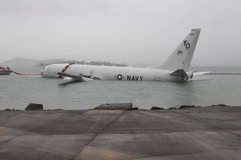 A ditched US Navy P-8A Poseidon aircraft in Kaneohe Bay, Hawaii.