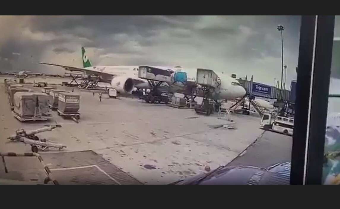 An Eva Air Boeing 777 is struck by 2 runaway baggage trailers at Bangkok Airport