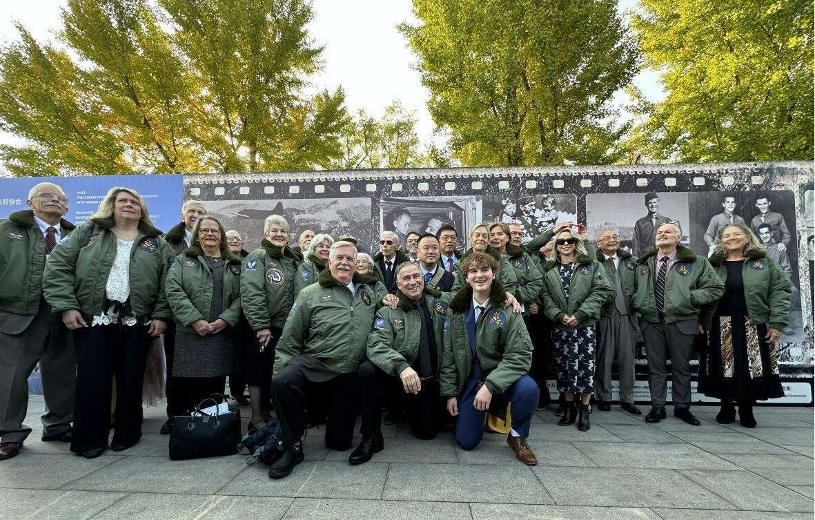 A group celebrates the 80th Flying Tigers anniversary.