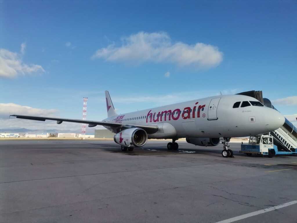 A Humo Air Airbus parked at the terminal.