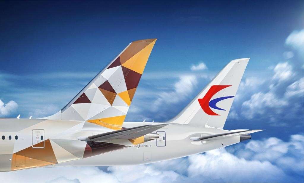 Render of tailplanes of Etihad Airways and China Eastern Airline jets together.