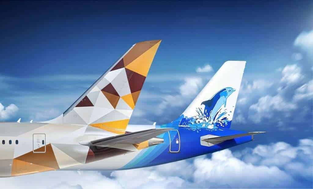 Render of tailplanes of Etihad Airways and Maldivian jets together.