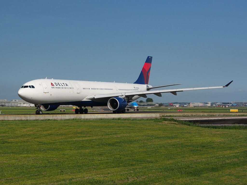 A Delta Airlines aircraft parked on the tarmac.