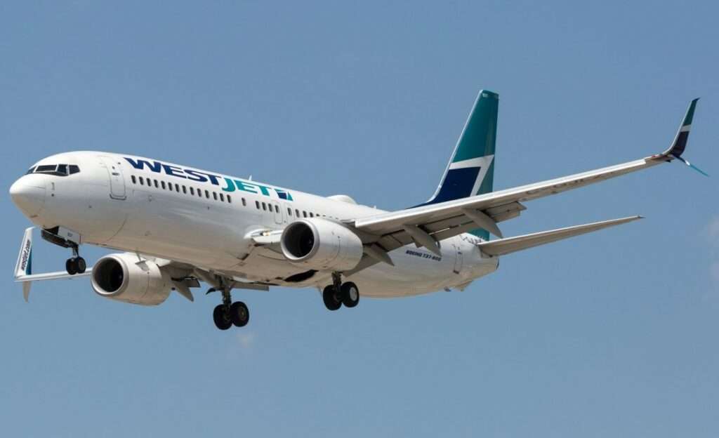 A WestJet Boeing 737-800 approaches to land.