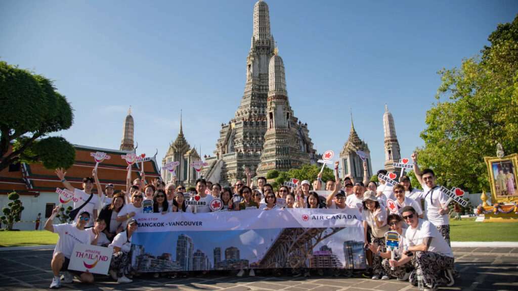 A group in Bangkok celebrates return of Air Canada flights from Vancouver.