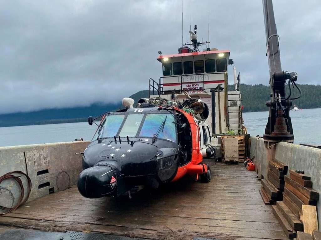 Wreckage of US Coast Guard MH-60 helicopter on barge at Read Island, Alaska.