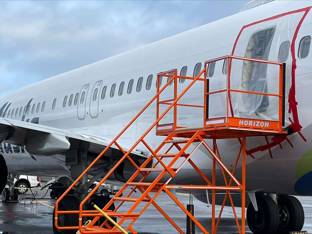 A service ladder at the aft cabin door recess of Alaska Airlines Boeing 737 MAX 9