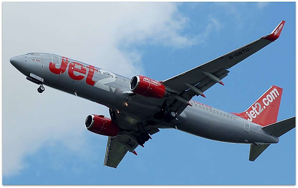A Jet2 Boeing 737 passes overhead.