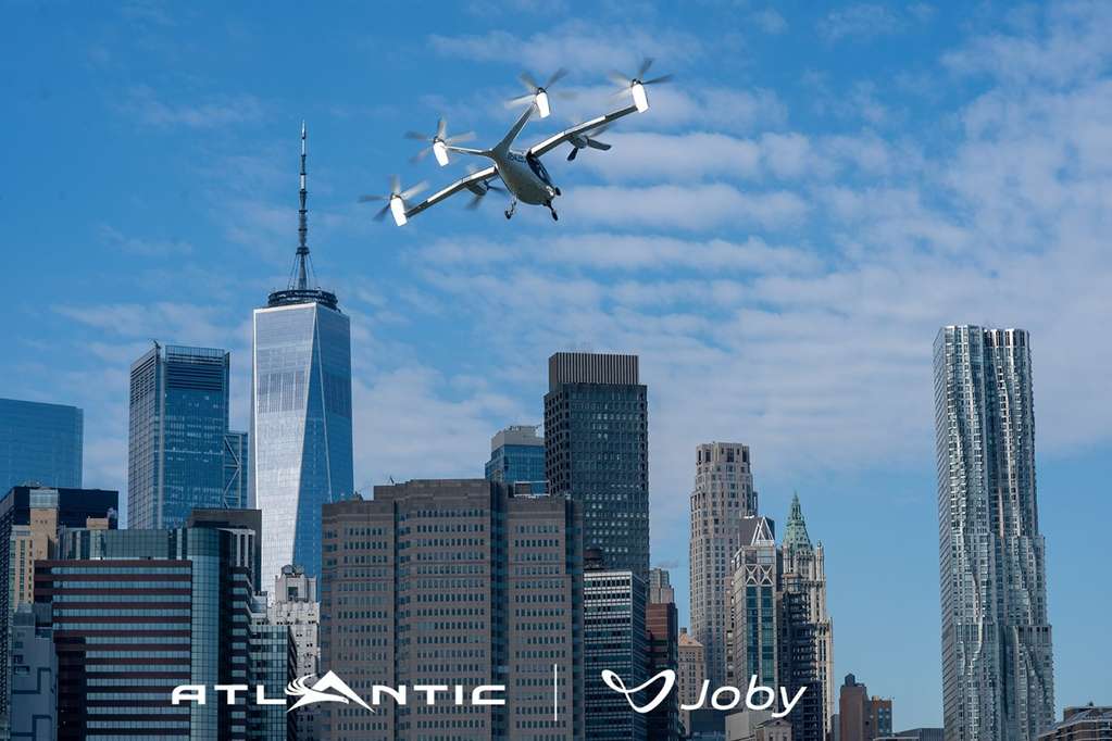 A Joby Aviation eVTOL air taxi above the New York city skyline.