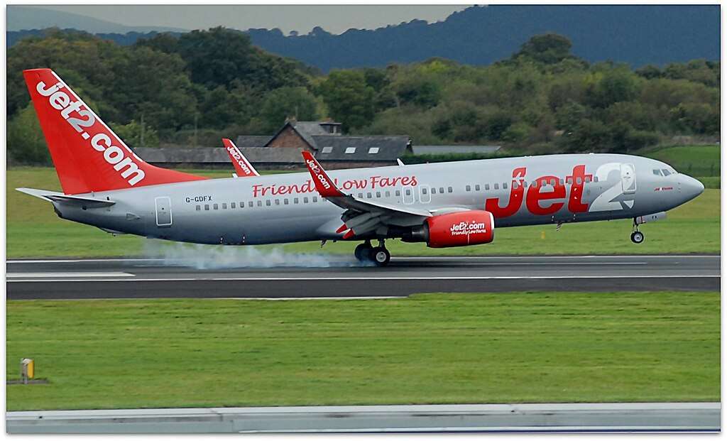 A Jet2 737 touches down in Manchester.