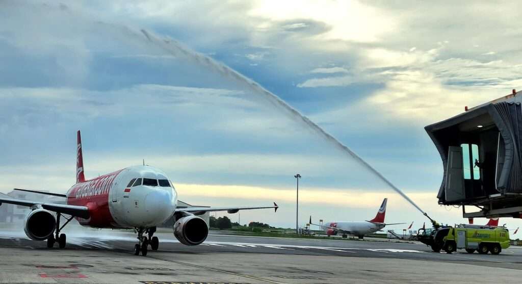 An Indonesia AirAsia flight gets a water cannon salute at Kota Kinabalu