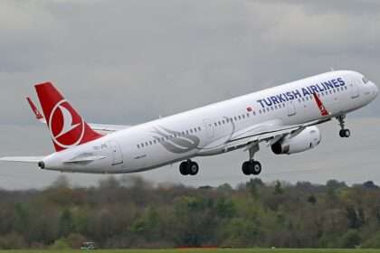 A Turkish Airlines A321 climbs out after takeoff.