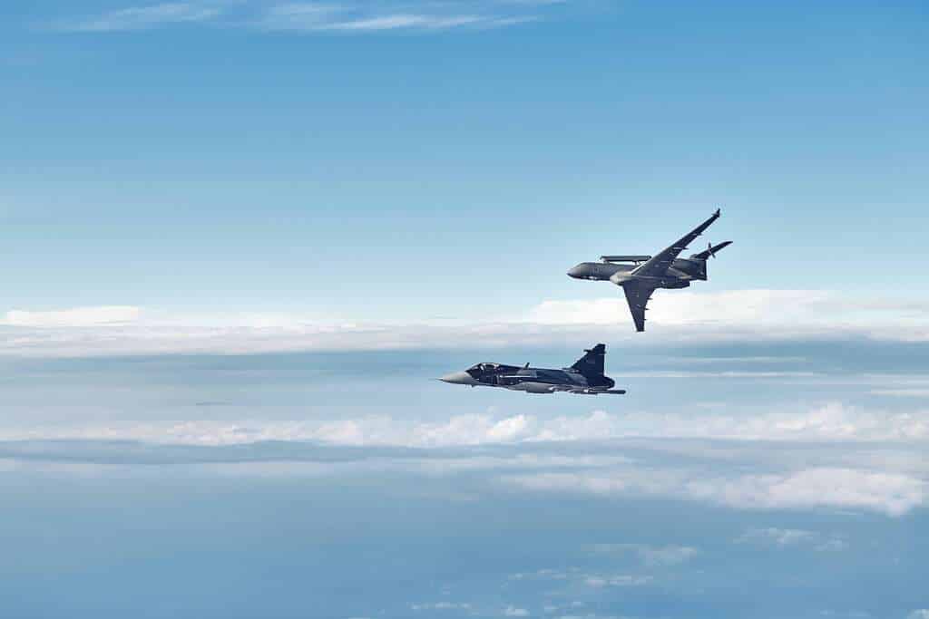 A Saab Gripen and GlobalEye aircraft fly together.
