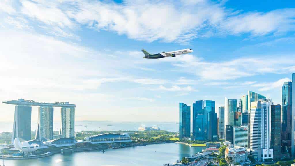 An Airbus jet flies over the Singapore skyline.