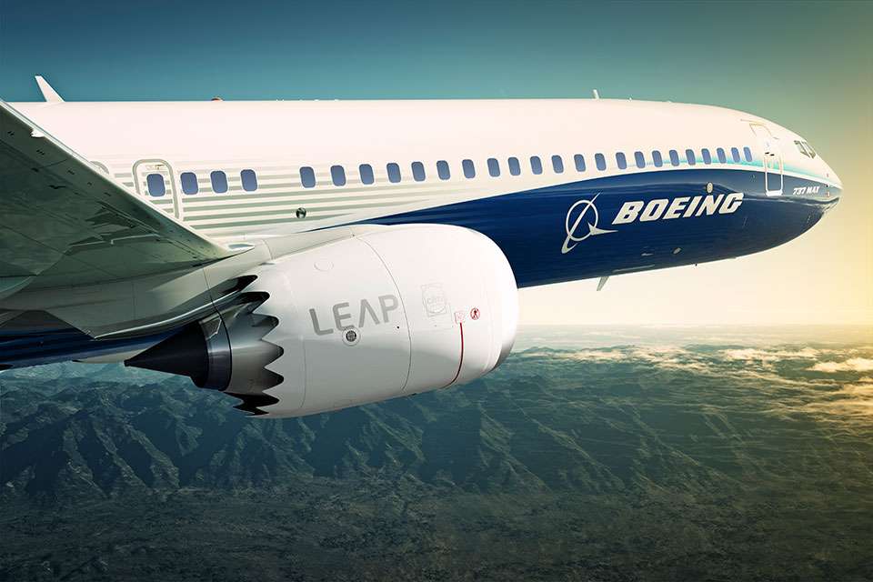 President Biden Jokes About Boeing: "I Don't Sit By The Door"