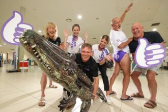 Passengers and staff welcome Bonza in the Northern Territory.