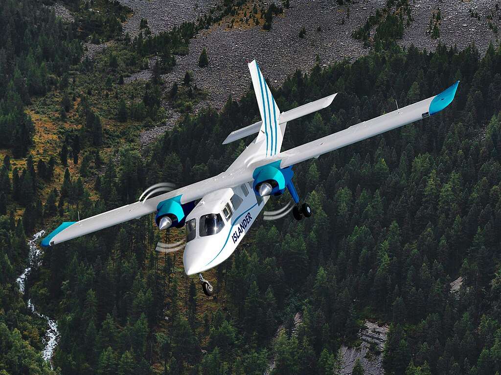 Render of a Britten-Norman Islander flying over forest.