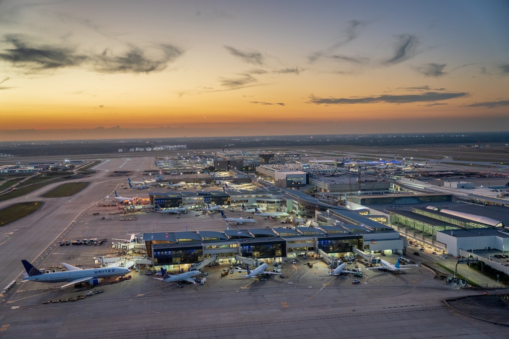 Aerial view of George Bush Intercontinental Houston Airport at sunset.