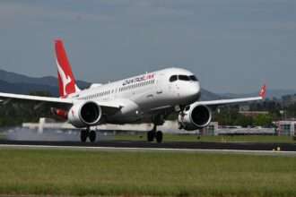 A Qantaslink A220 lands at Canberra