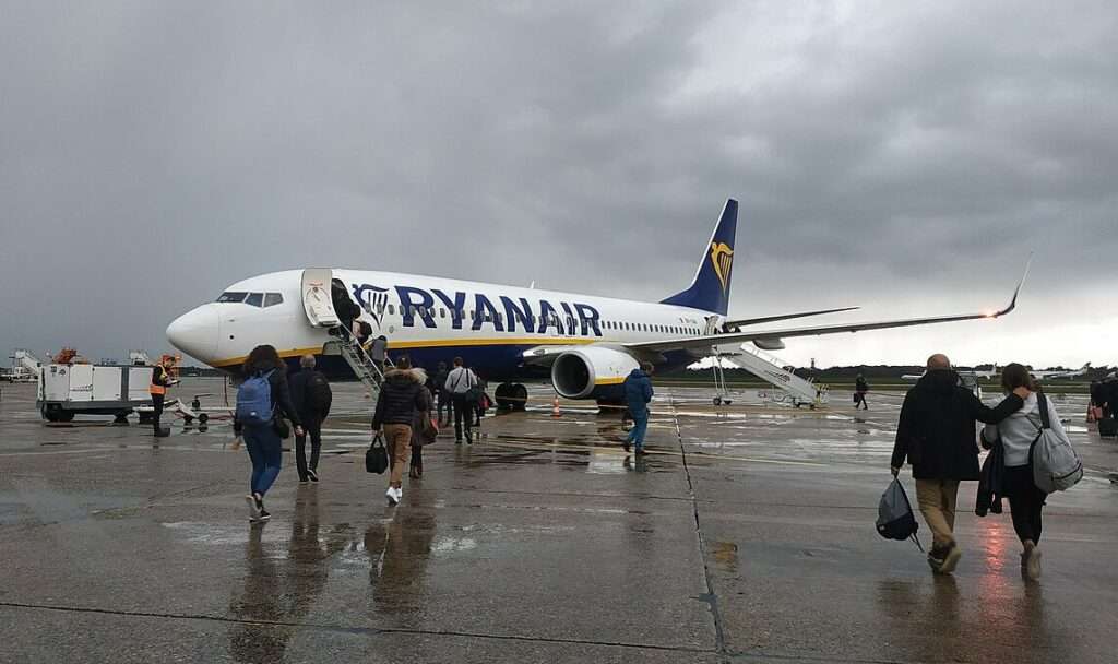Passengers walk to a Ryanair 737 parked at Bordeaux-Merignac Airport