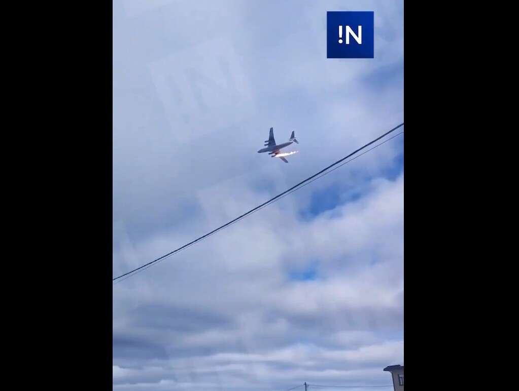 A Russian Ilyushin Il-76 passes near Severny airfield with an engine on fire.