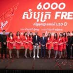 AirAsia Cambodia staff stand with airline CEO.
