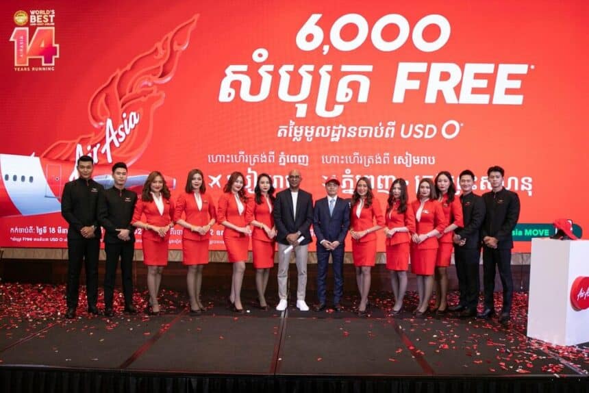 AirAsia Cambodia staff stand with airline CEO.