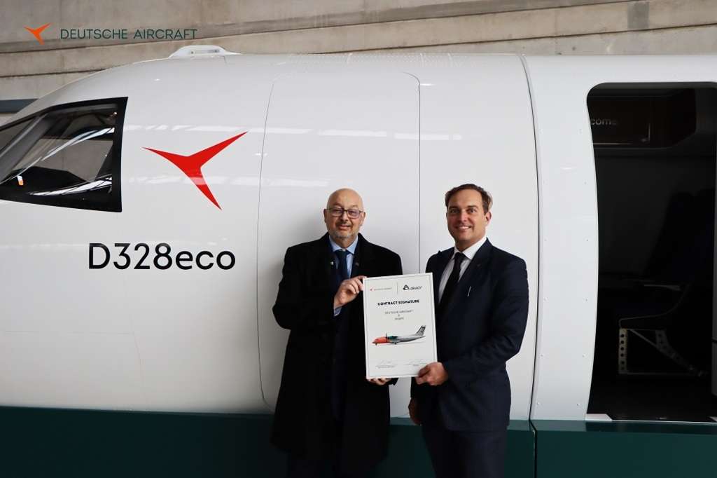 CEOs of Deutsche Aircraft and Akaer stand with D328eco aircraft