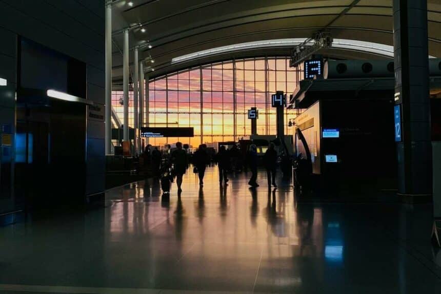 interior of an airport terminal at sunset.