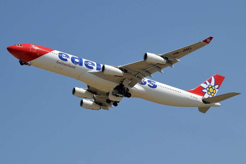 An Edelweiss Airbus A340 climbs after takeoff.