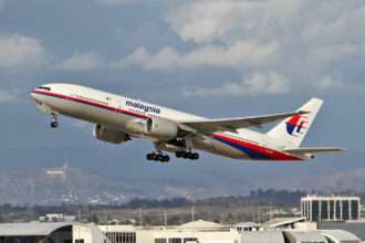 A Malaysia Airlines Boeing 777 registered 9M-MRO takes off.