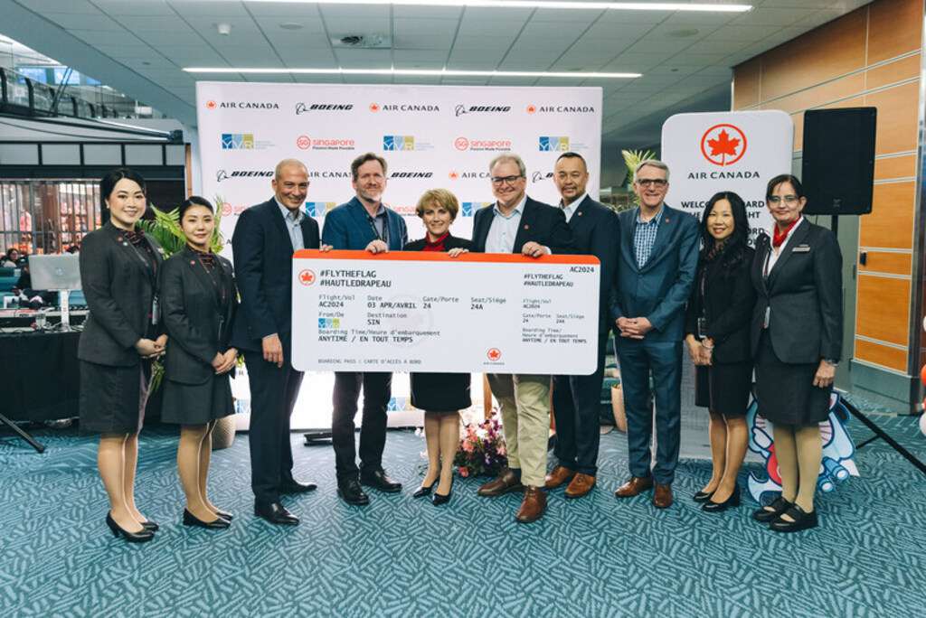 Air Canada staff celebrate the new Vancouver-Singapore route