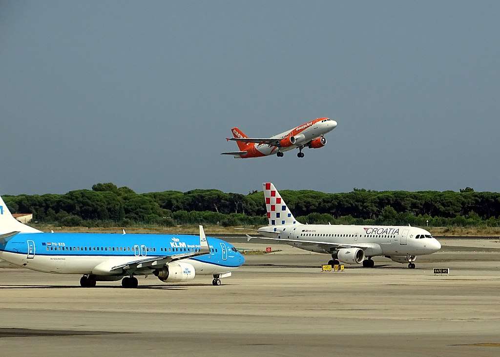 Croatia Airlines and KLM aircraft taxi as an easyJet flight takes off.
