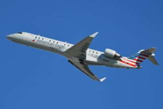 An American Airlines CRJ-700 jet in flight.