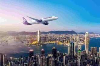 Render of HK Express aircraft over city.