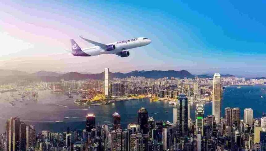 Render of HK Express aircraft over city.