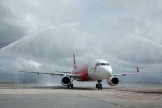 An AirAsia flight receives a water cannon salute in East Malaysia.