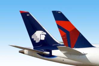Tailplanes of a Delta Air Lines and Aeromexico aircraft