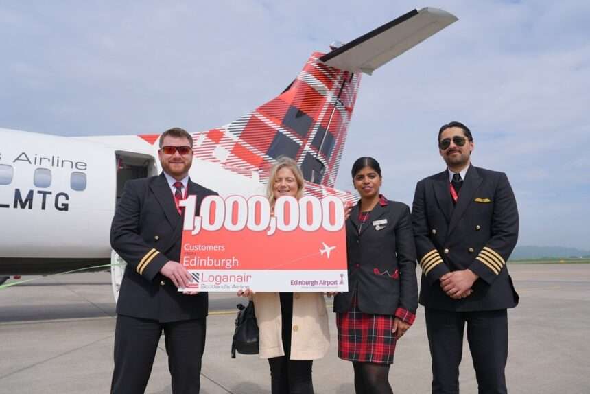 Loganair staff with one millionth customer at Edinburgh Airport