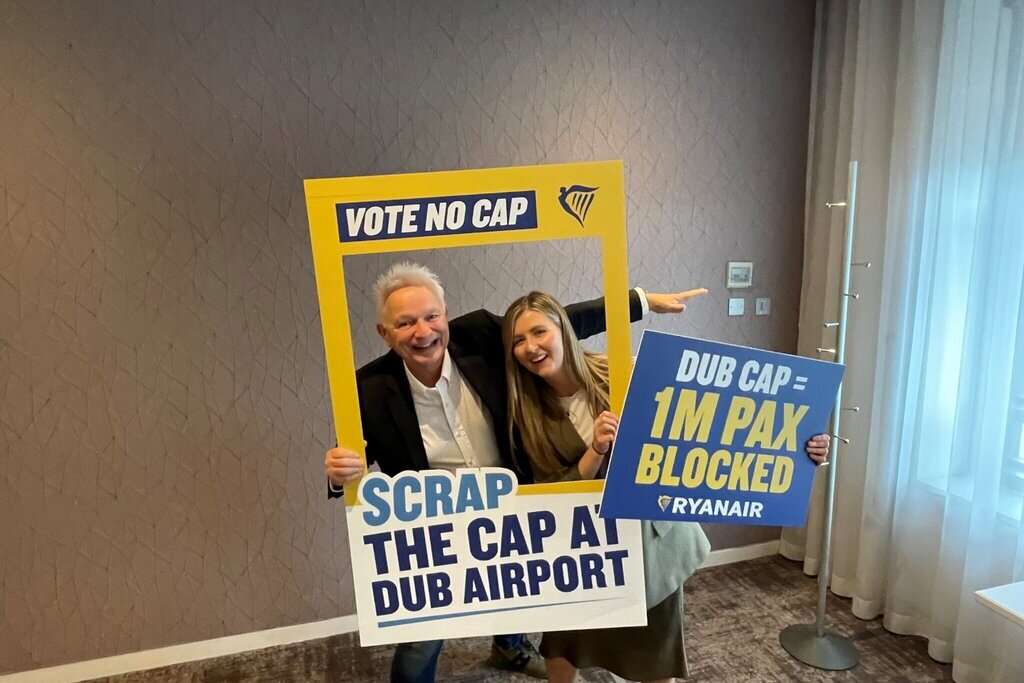 Ryanair officials with Dublin Airport sign