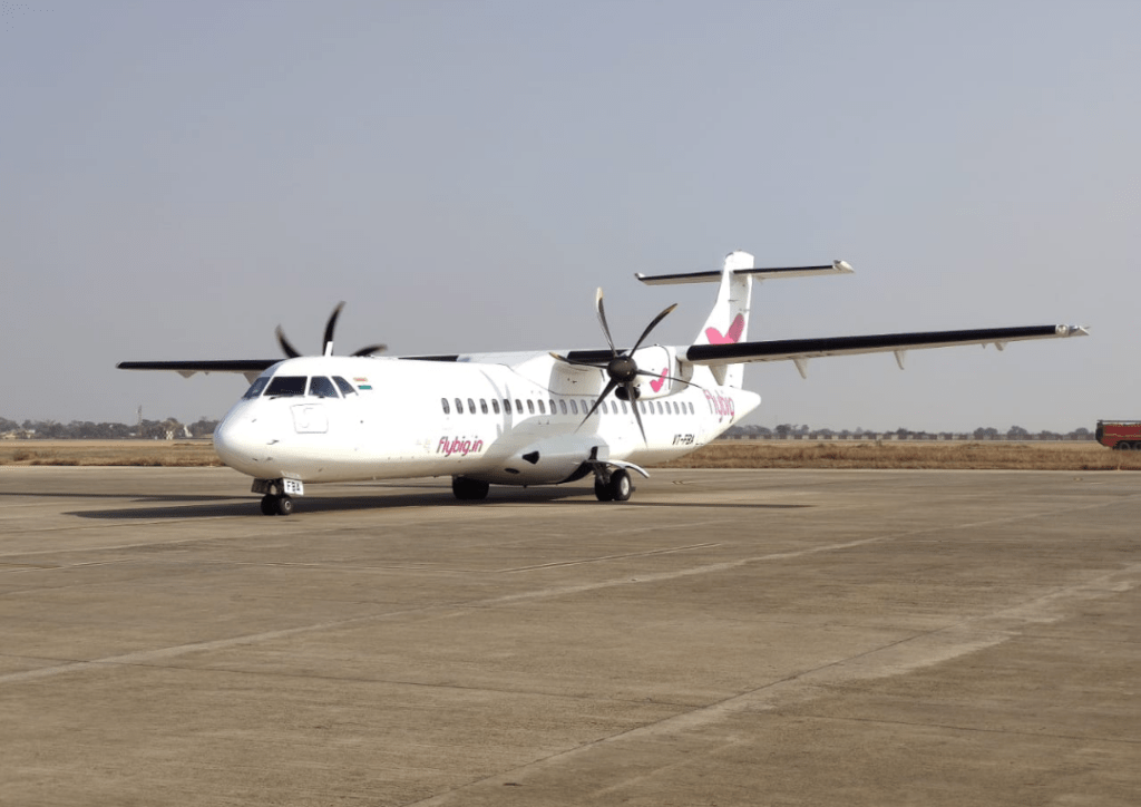 A flybig Dash 8 aircraft taxis after landing Raipur.