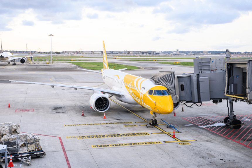 A Scoot Embraer E190 jet at the terminal.
