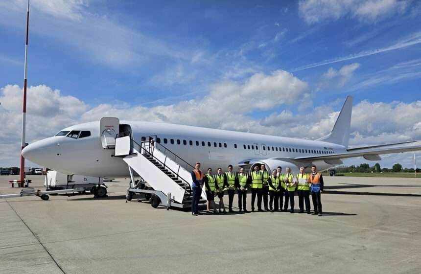 Ascend Airways staff with aircraft on tarmac.