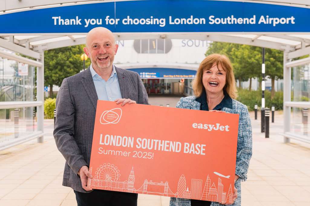 London Southend Airport and easyJet representatives with sign.