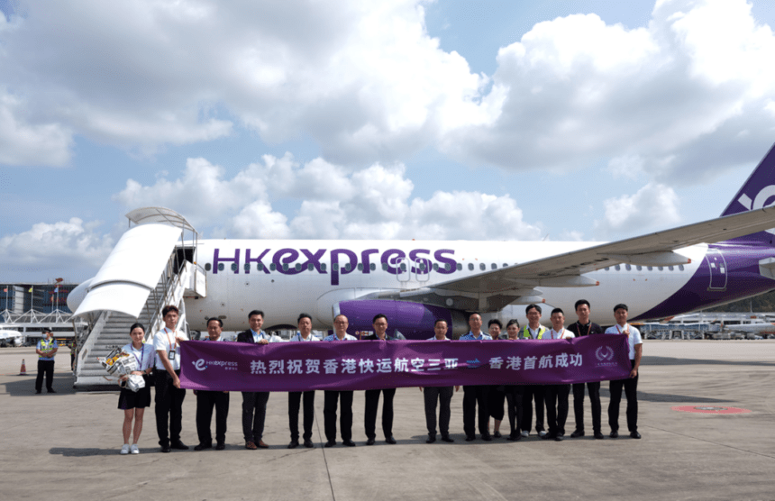 Airline staff with HK Express aircraft.